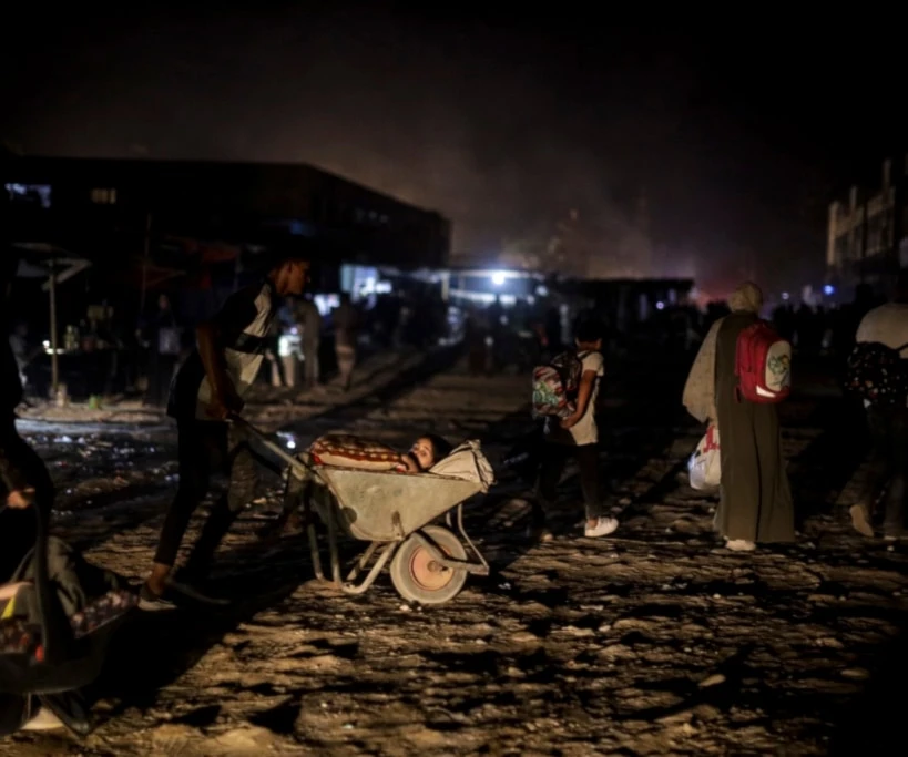 Palestinians displaced by the Israeli genocidal war on the Gaza Strip flee from parts of Khan Younis following an evacuation orders on Monday, July 1, 2024. (AP)